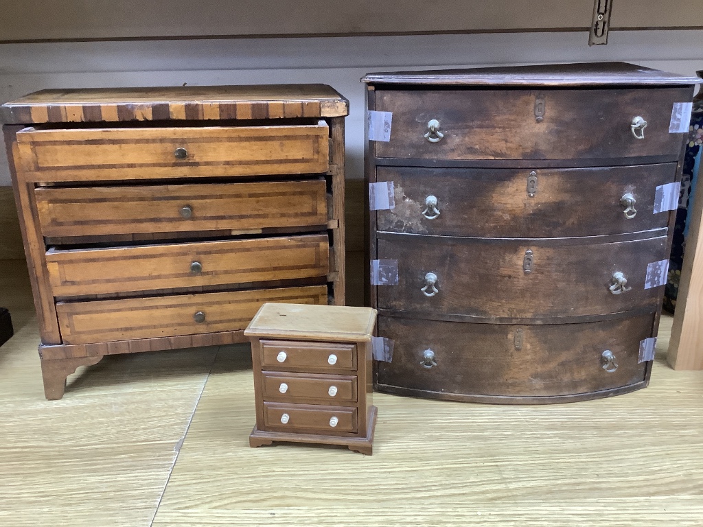 An 18th century Dutch inlaid walnut miniature chest of drawers, a 19th century mahogany bow-fronted miniature chest and another miniature chest, tallest 31cm